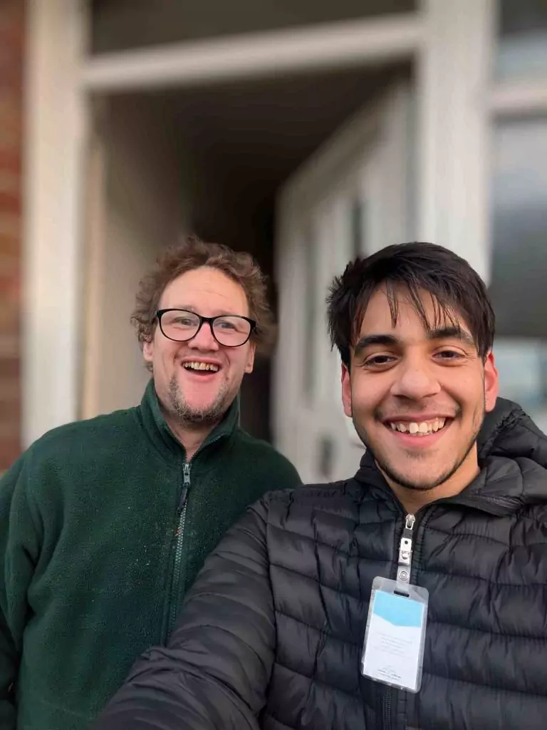Two men one milkman take a selfie.